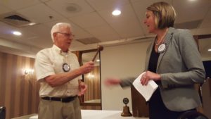 The passing of the gavel to President Elect, Amanda Filizetti.